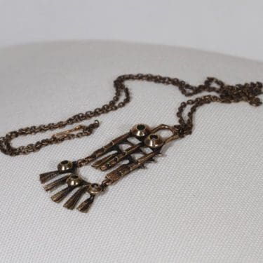 Turun hopea kaulakoru, pronssi, suunnittelija Pentti Sarpaneva, pronssi