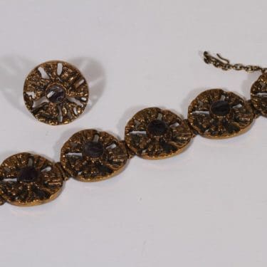 Turun Hopea Auringonkehrä rannekoru ja sormus, pronssi, suunnittelija Pentti Sarpaneva, pronssi, kivellinen, ametisti