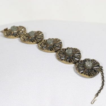 Turun Hopea Auringonkehrä rannekoru, pronssi, suunnittelija Pentti Sarpaneva, pronssi