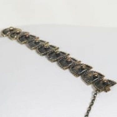 Turun Hopea Riikinkukko rannekoru, pronssi, suunnittelija Pentti Sarpaneva, pronssi